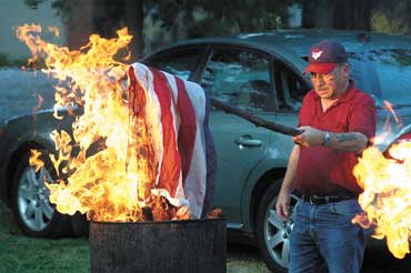 Flags burn with honor