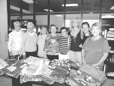 Quilts donated to police to aid victims